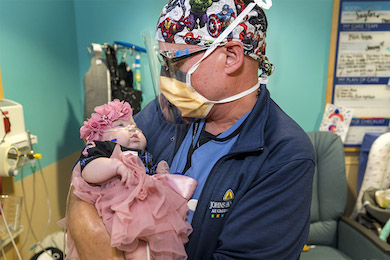Jason Smithers, M.D., with patient baby Saylor at Johns Hopkins All Children's Hospital
