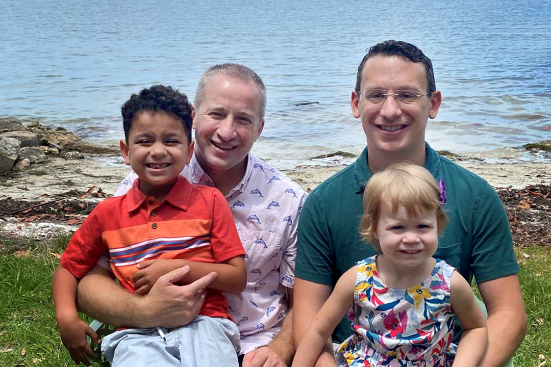 Matt Werling with his husband and their two children