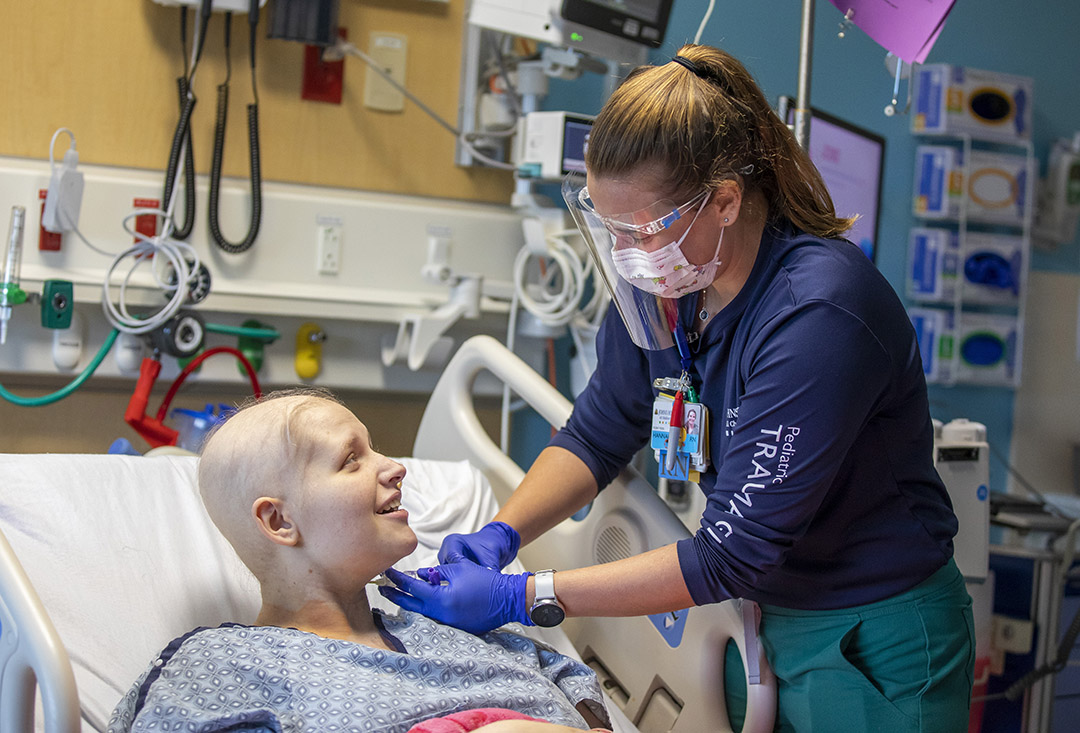 Keely, a patient in the Johns Hopkins All Children's Cancer & Blood Disorders Institute, with Hannah Clark, R.N.