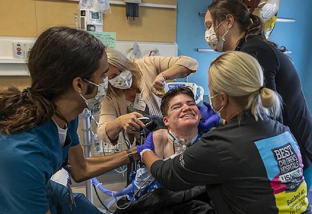 Jack’s care team and Kelly Slade lift Jack’s spirits with a haircut.
