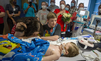 A photo of Marvin's family with him in the hospital