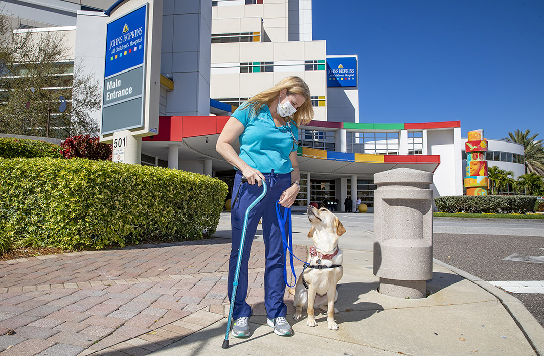 Brea with Leah Frohnerath, M.S., CCLS, at Johns Hopkins All Children's.