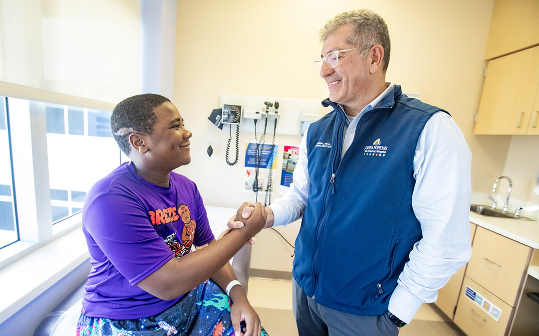 Patient Aaron with Dr. George Jallo