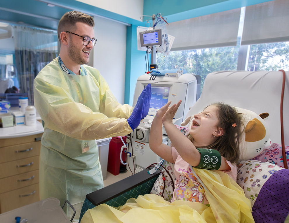 Josh Evens, R.N., and 8-year-old Amanda have developed a heartfelt bond during her 3-day-week dialysis visits at Johns Hopkins All Children's Hospital.