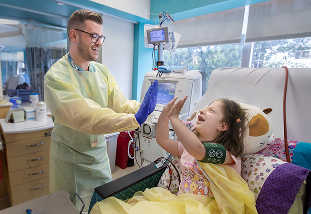Josh Evens, R.N., and 8-year-old Amanda have developed a heartfelt bond during her 3-day-week dialysis visits at Johns Hopkins All Children's Hospital.