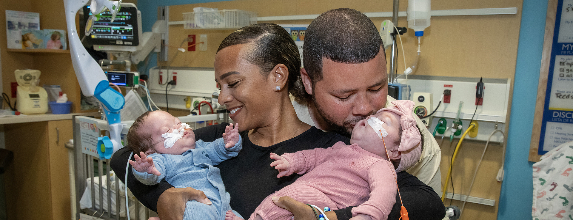 Charlotte and Jett with their parents Chelsea and Joshua in the neonatal intensive care unit at Johns Hopkins All Children's Hospital