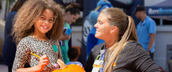 A nursing letting a patient paint her face at an event.