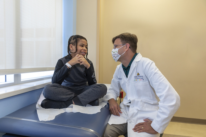 Matthew Smyth, M.D. and patient Dae'shaun at Johns Hopkins All Children's Hospital.