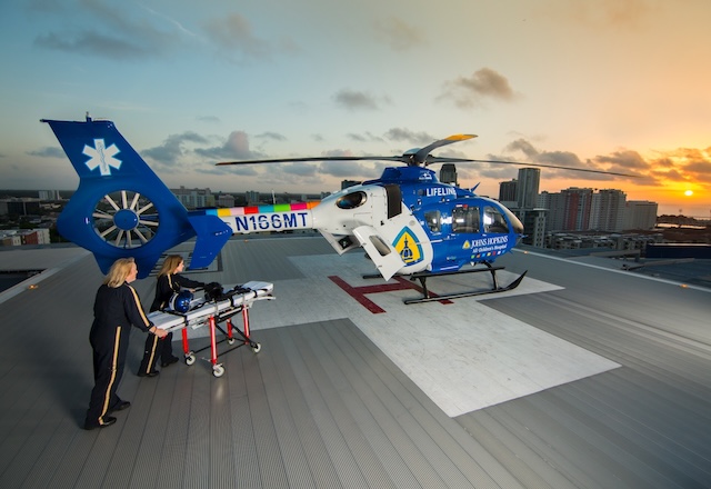 Two LifeLine team members on helipad