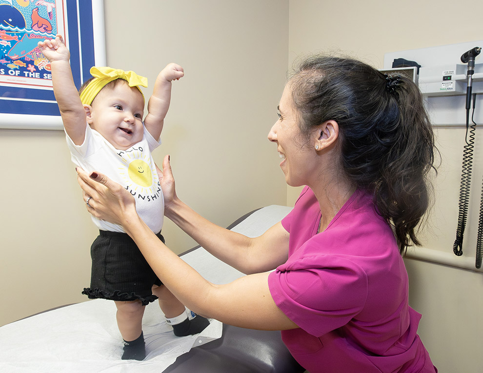 Nova, 10-months, and Sara Hartnett, M.D., pediatric neurosurgeon.