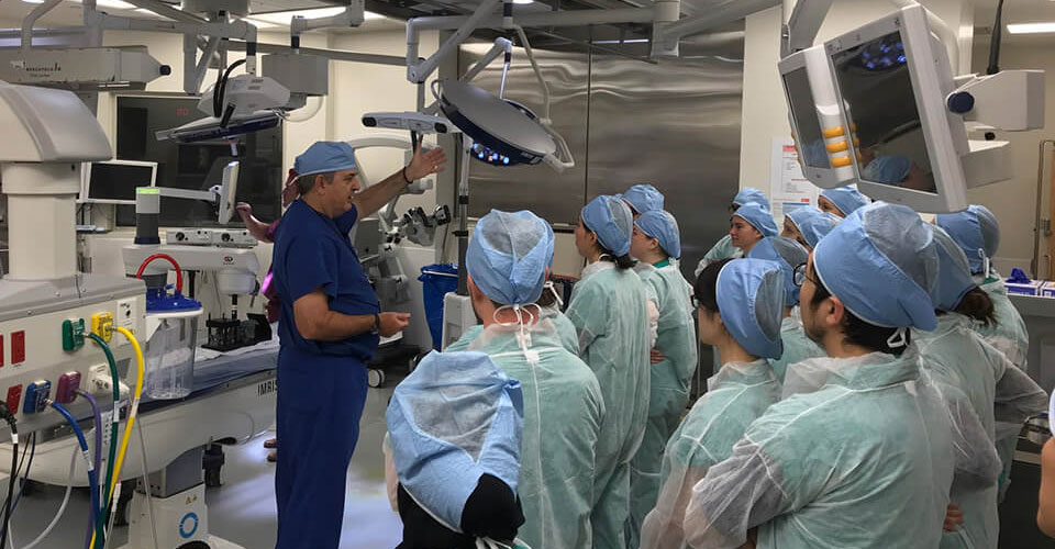 trainees listening to a lecture in the surgical suite