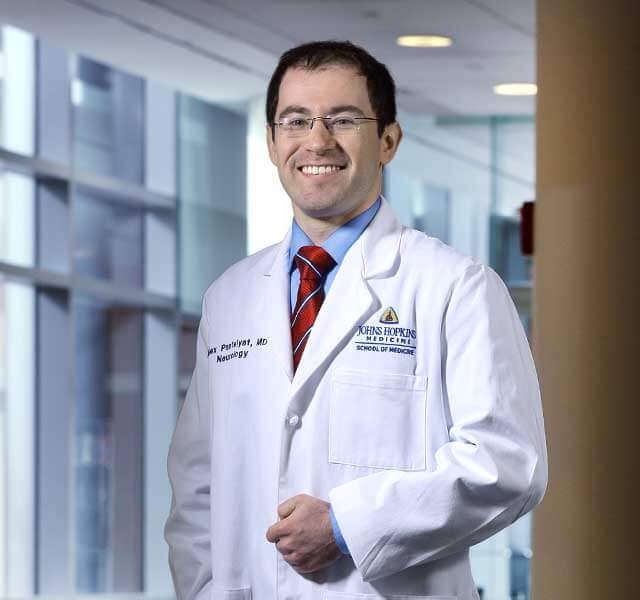 Dr. Pantelyat standing in a hospital hallway