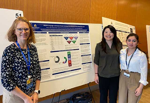 Dr. Muehlschlegel and team presenting a poster at a conference