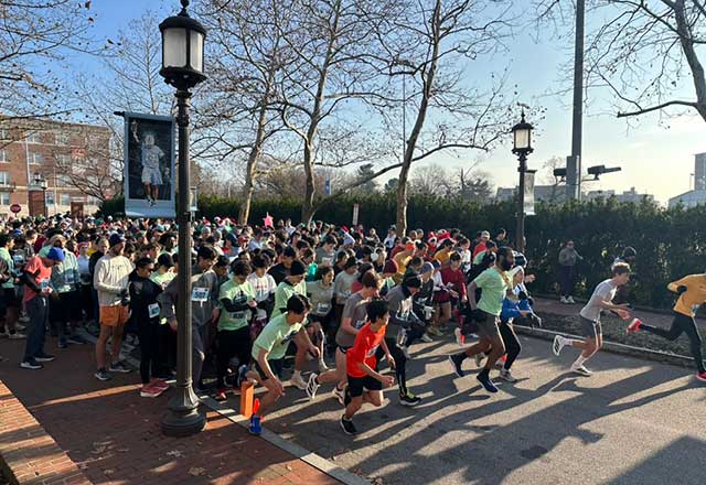A diverse group of runners participating in a 5K race, showcasing determination and teamwork along the race route.