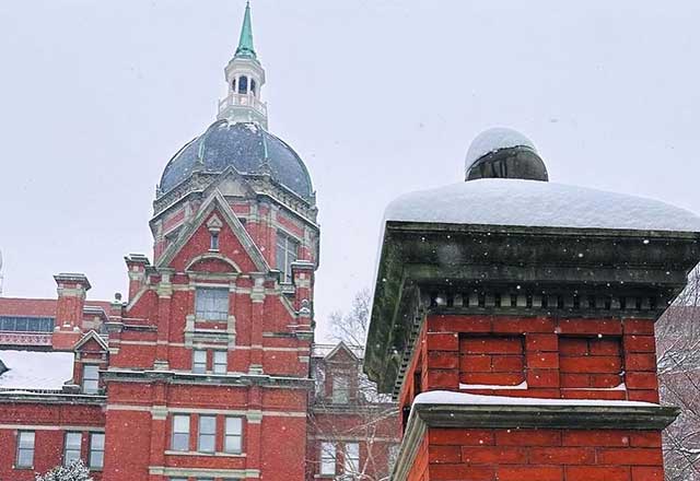 Johns Hopkins Dome building lightly covered in snow