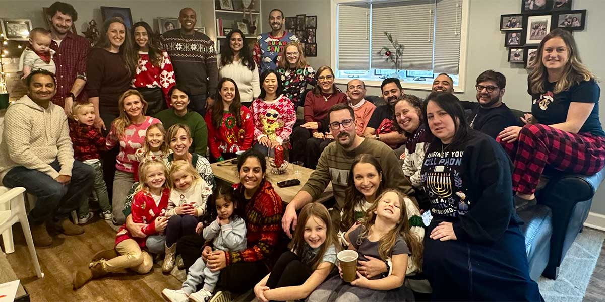 NCC fellows and their families gathered for an ugly sweater party