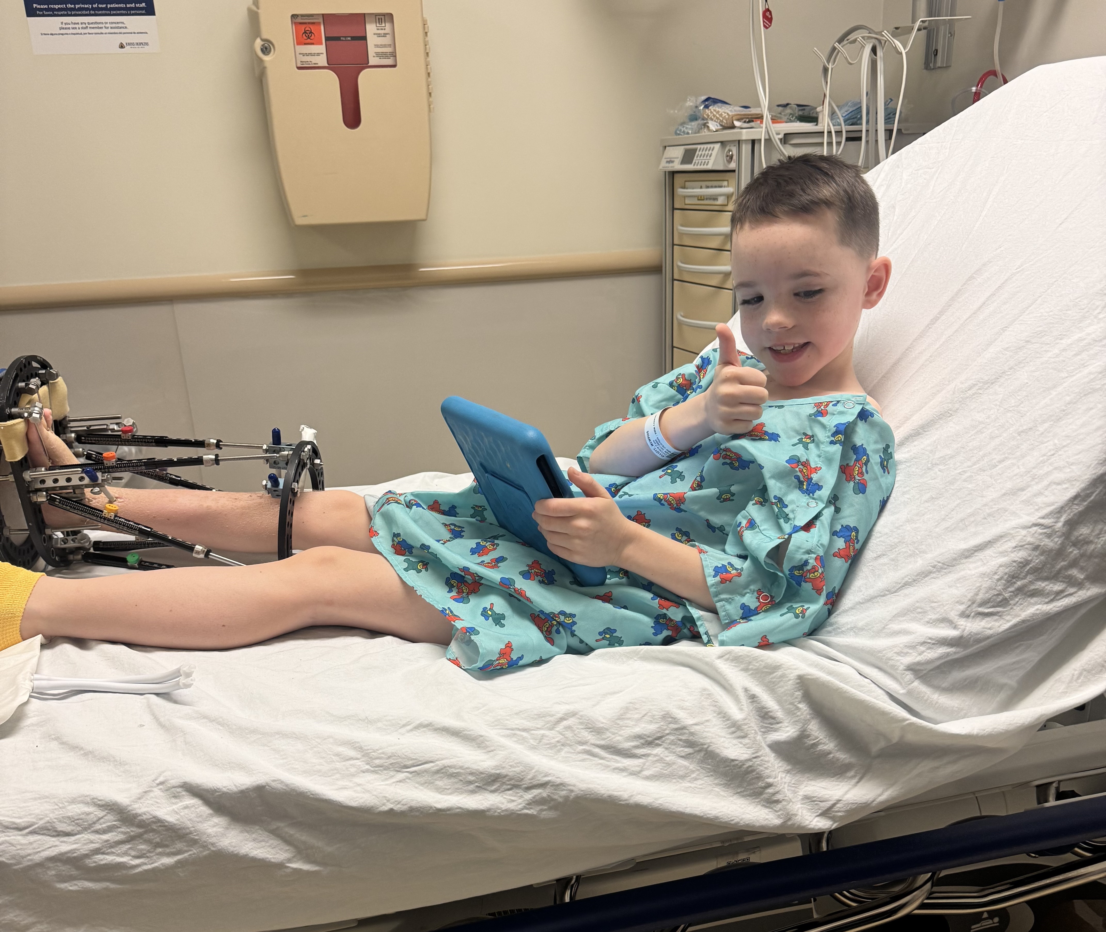 Boy recovering from leg-lengthening surgery