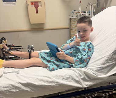 Boy recovering from leg-lengthening surgery