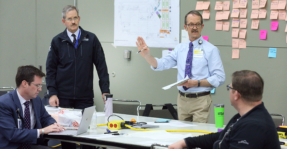 Dr. James Ficke discussing plans.