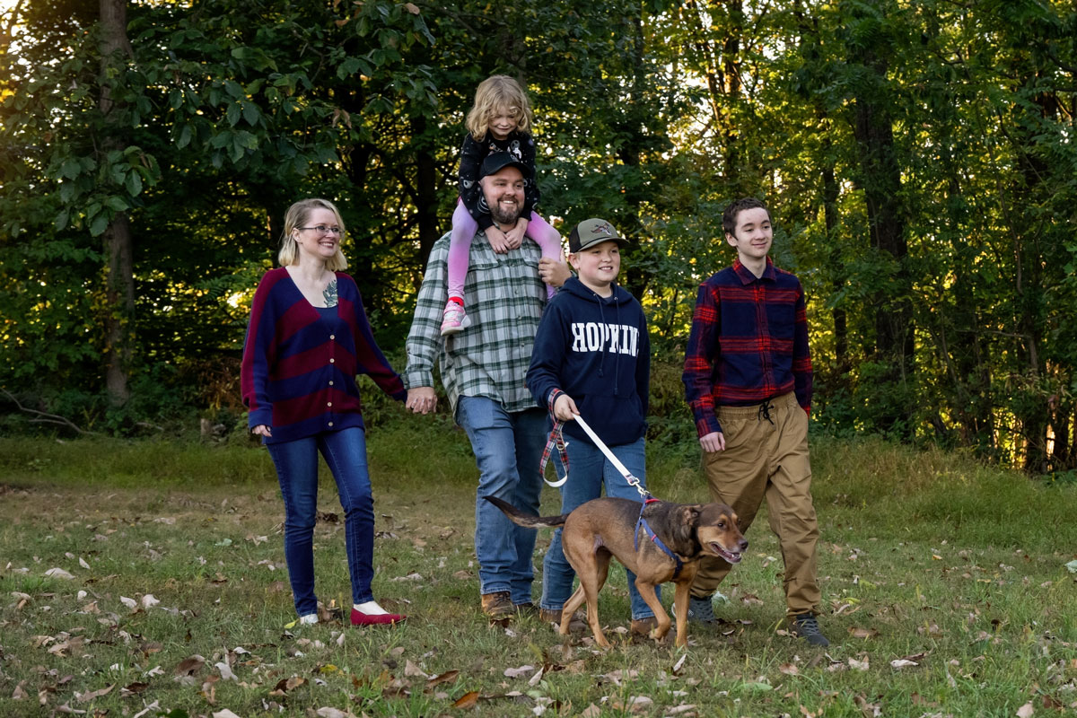 Camden Pack-Witmer with his family walking outside