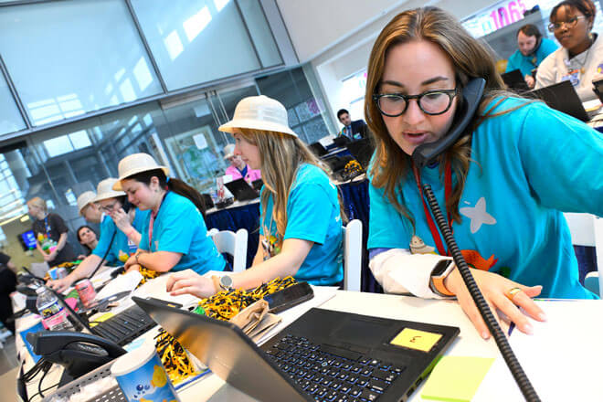 Volunteers taking calls at 2025 Radiothon event.