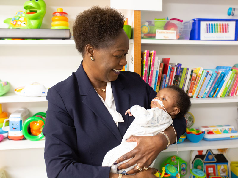 Ajoke Ajayi-Akintade with a young patient.