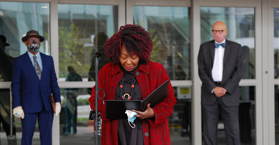 Hickman saying a prayer outside the Baltimore Convention Center Field Hospital.