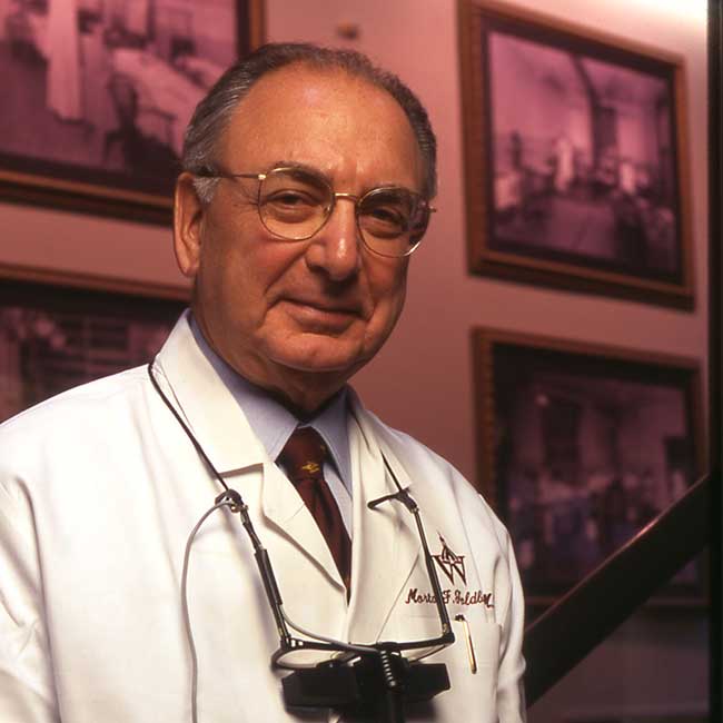 Doctor Morton Goldberg in a white coat