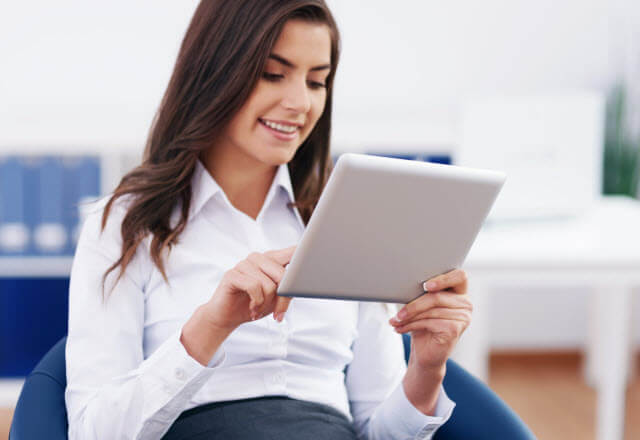 woman browsing on tablet