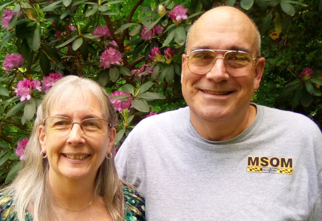 jean standing with her husband smiling