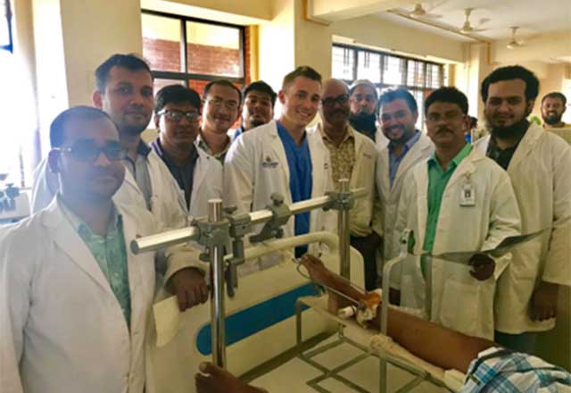 James Mackenzie standing with other doctors in Bangladesh 