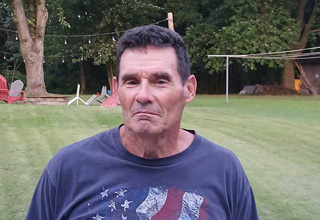 Jim standing in his back yard.