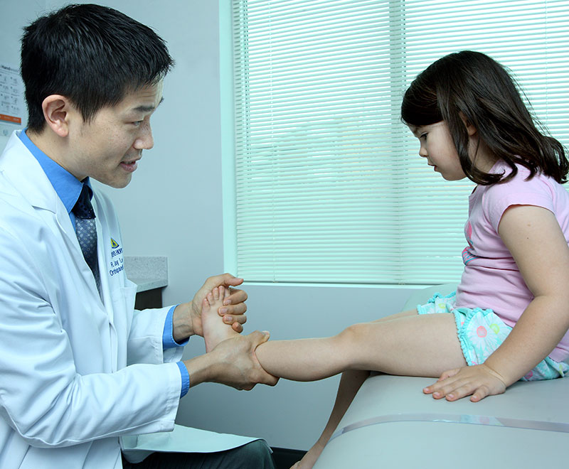 Dr. Jay Lee working with pediatric patient