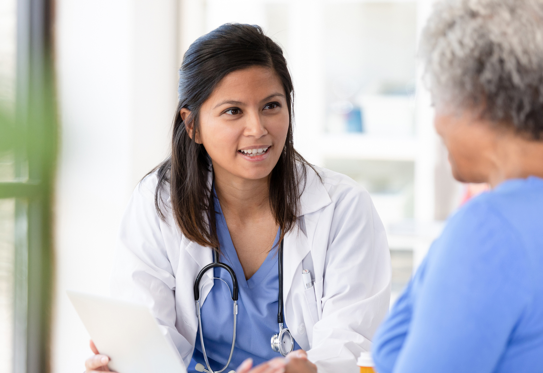 female doctor talking to patient