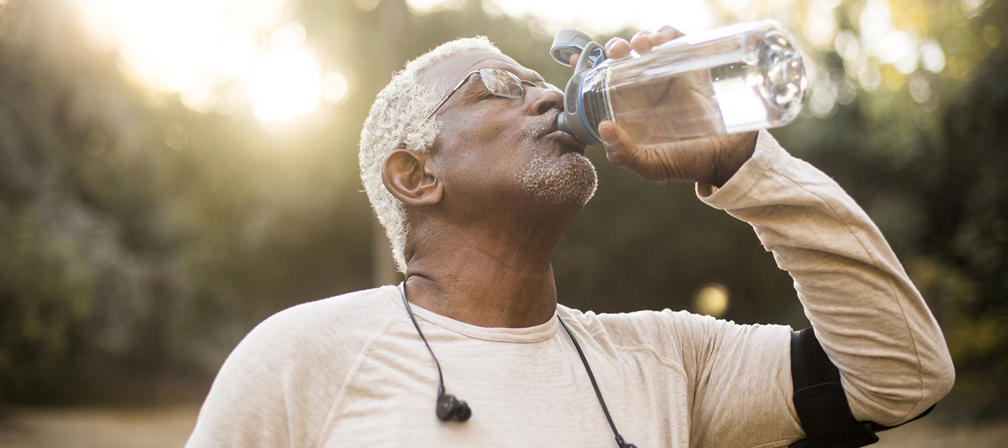 senior male drinking water