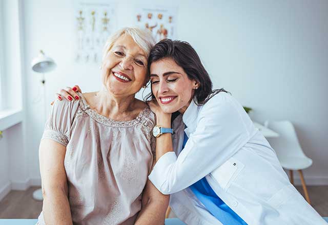 Doctor hugging patient. 