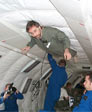 Dr. Shelhammer appears in his photo floating in the zero gravity lab. 
