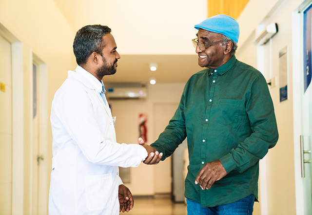 patient shaking hands with doctor