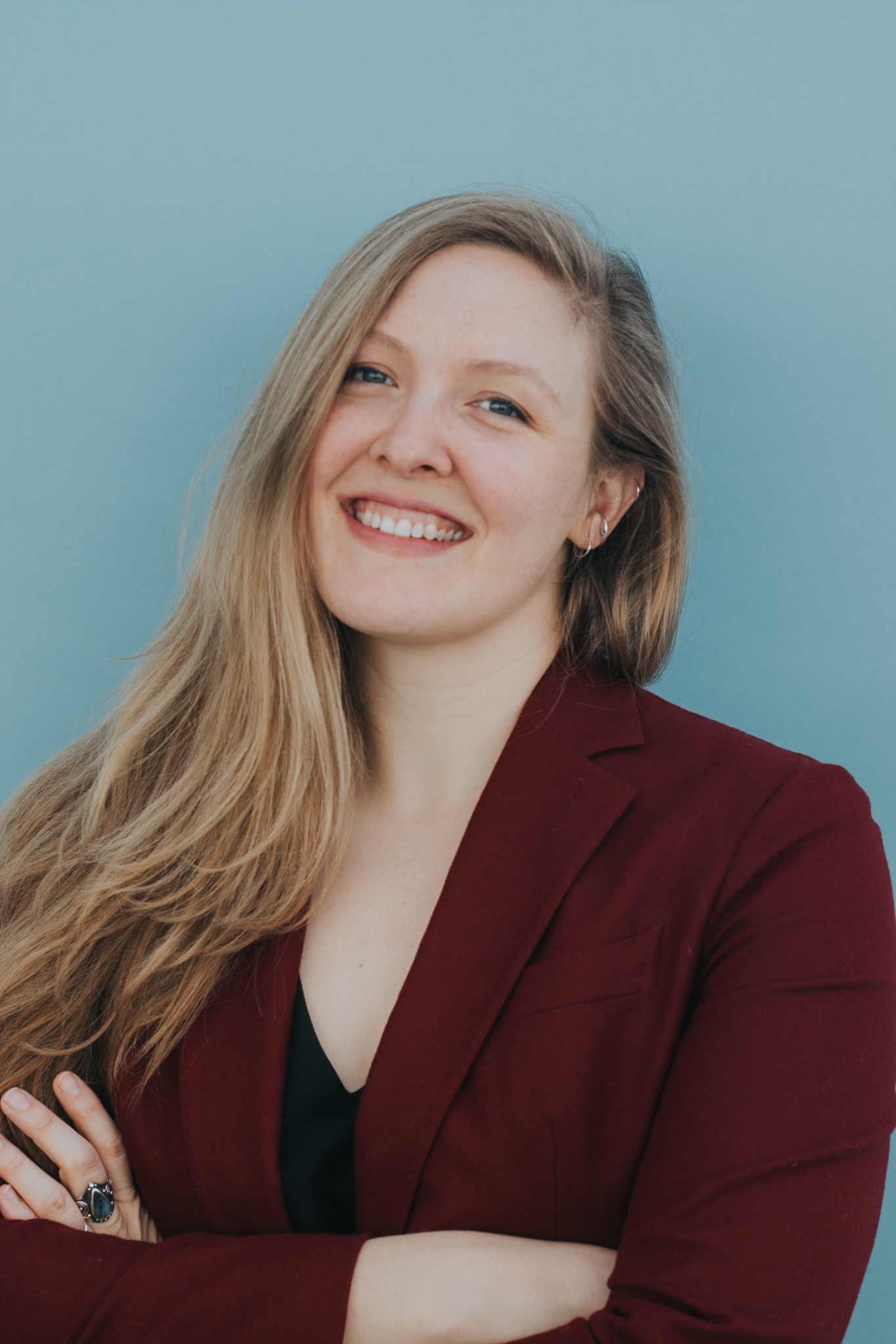 Joanna Rowe smiles for a professional photo.