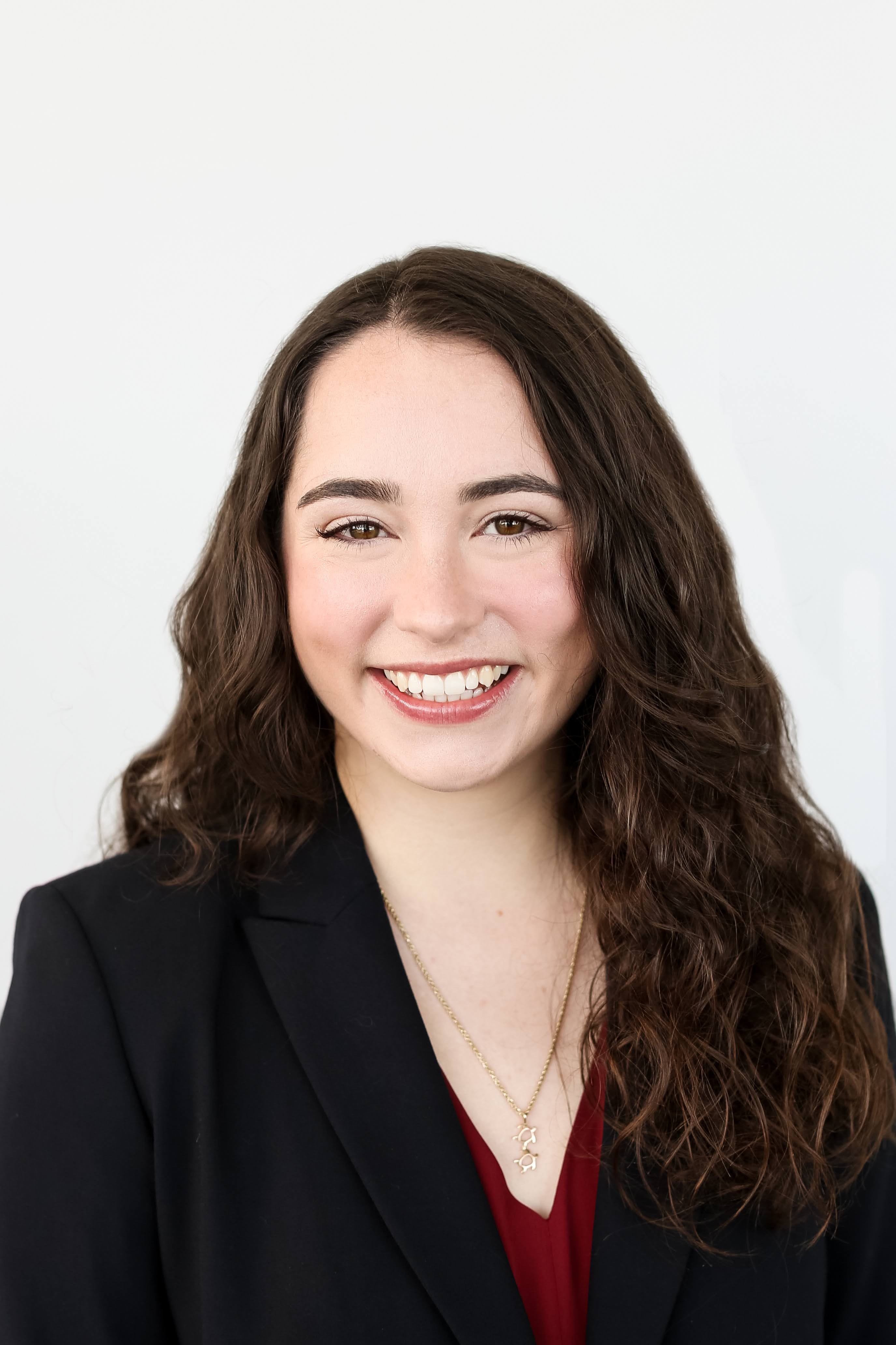 Rebecca McDonald smiles for a professional headshot.