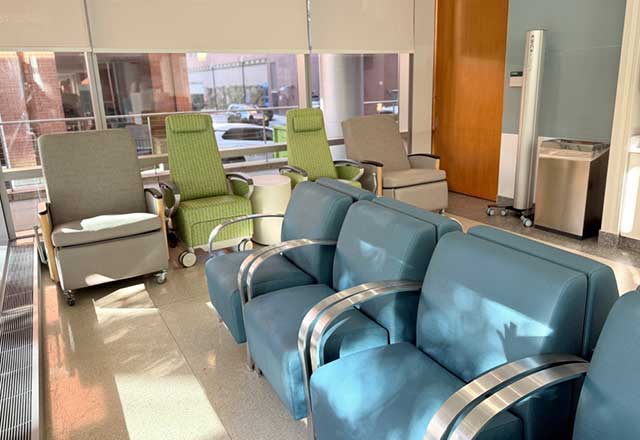 Empty row of comfortable chairs in the sun-lit patient discharge lounge at The Johns Hopkins Hospital