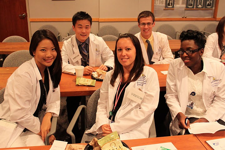 group of interns in lab coats