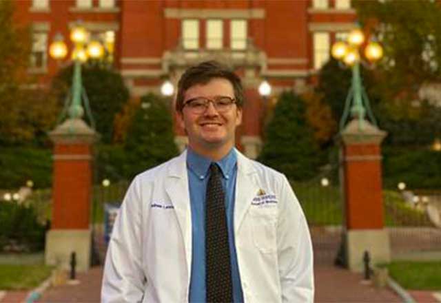 Andy Lancaster standing in from on the Johns Hopkins School of Medicine.