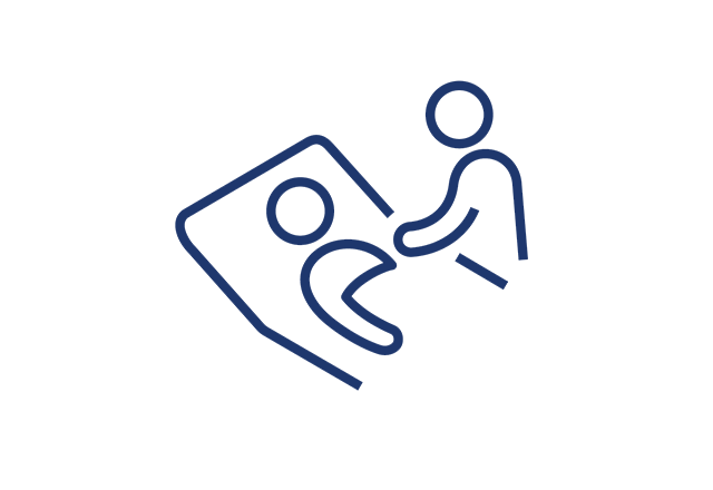 Icon of a healthcare provider caring for a patient in a hospital bed.