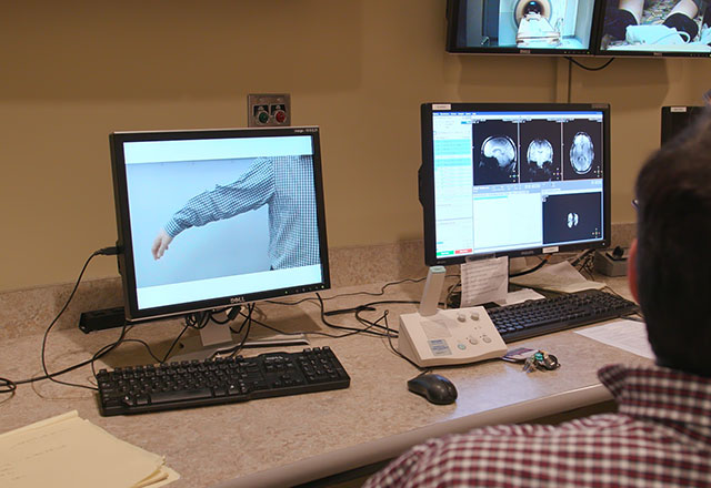 a researcher connects Buz to the device
