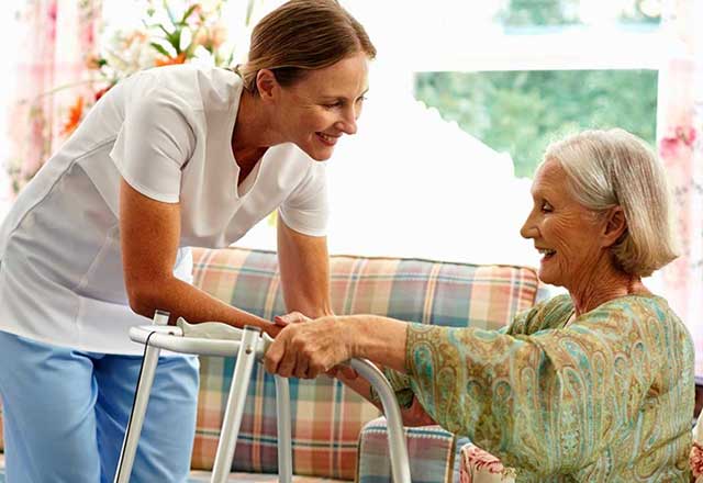 Provider assisting an elderly patient