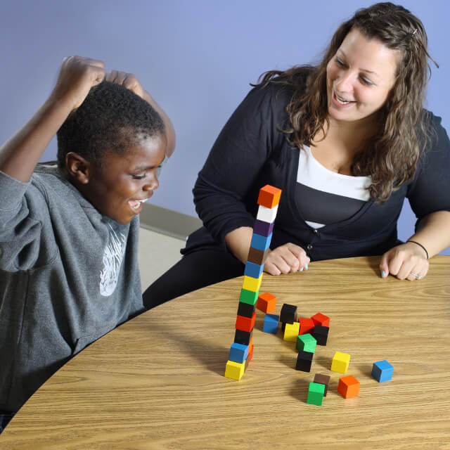 kid playing with blocks