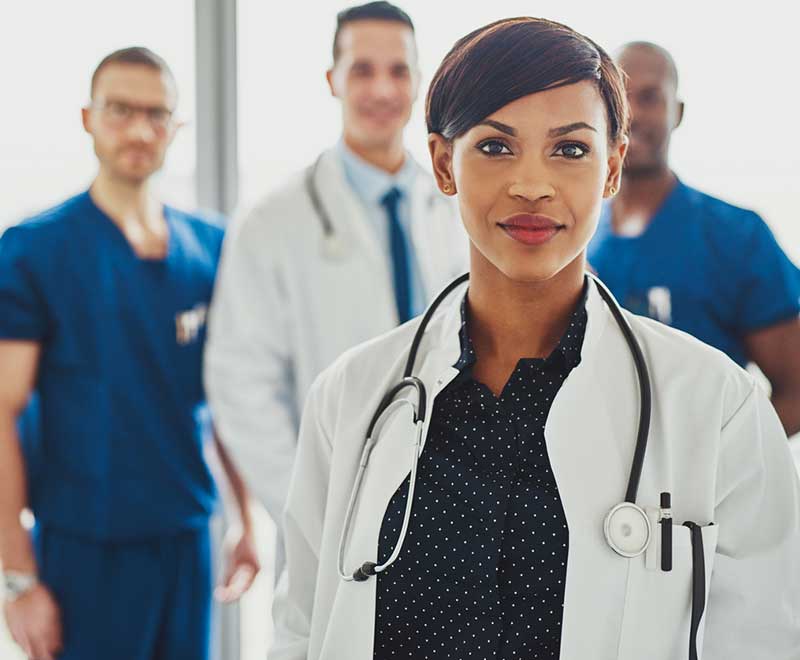 female doctor with other medical professionals