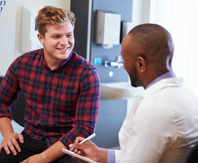 young man at doctors appointment