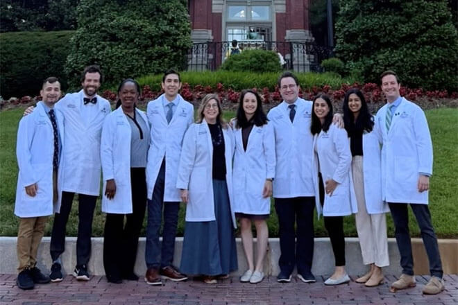 Pulmonology fellows standing in front of The Johns Hopkins Hospital